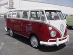 Beautifully restored Volkswagen 13-window deluxe bus with stock titian red paint job
