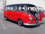 Beautiful custom VW 13-window deluxe bus is slammed and painted black over cherry red
