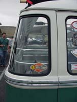 Detail view of the curved rear window on a VW 23 window deluxe samba bus