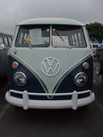 Photo shows front end of a Volkswagen 13-window deluxe bus