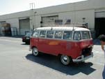 Vintage Volkswagen 15-window deluxe bus painted selaing wax red on lower half