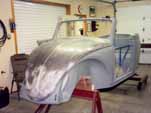 Pound out and heat-shrinnk the 1954 VW convertible front hood
