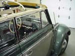 Side view of the restored 1954 Volkswagen convertible bug before the top canvas was installed
