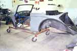 1954 VW Cabriolet is mounted on a rolling dolly so the bodywork can continue