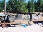 Image of a 1954 VW Cabriolet mounted on a rotisserie during the restoration