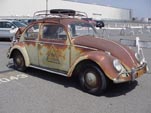Original VW bug with vintage graphics and sunburned original paint