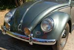 Photo shows vintage yellow front fog lights installed on the restored 1954 Volkswagen convertible bug